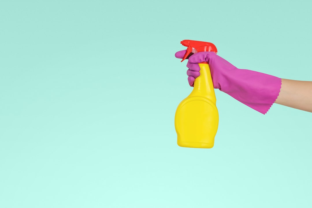 Services-01 person-holding-yellow-plastic-spray-bottle-zmnefoi3k